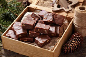 A box full of chocolate fudge with nuts